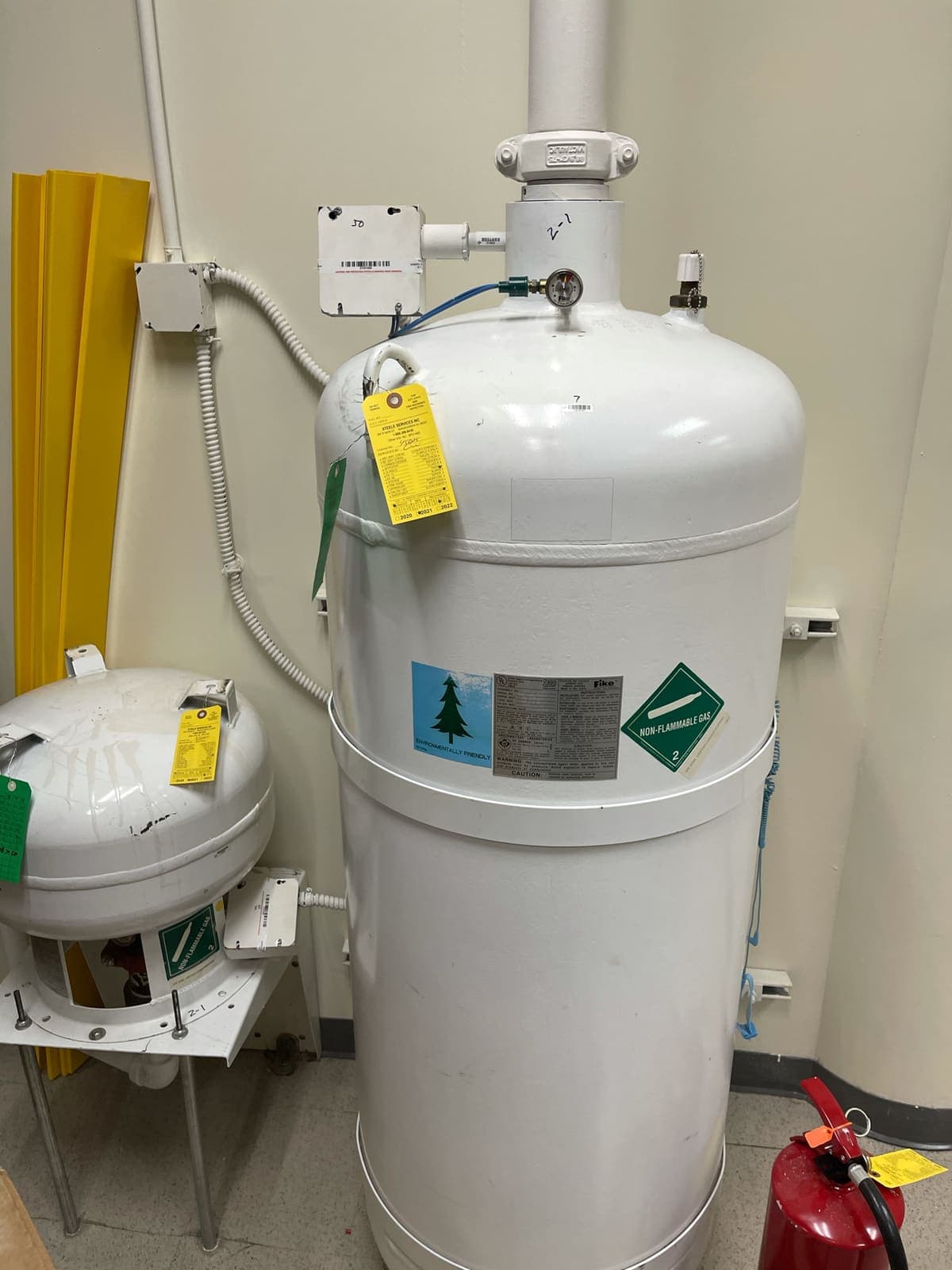 Fike clean agent cylinder with service tags inside the protected room