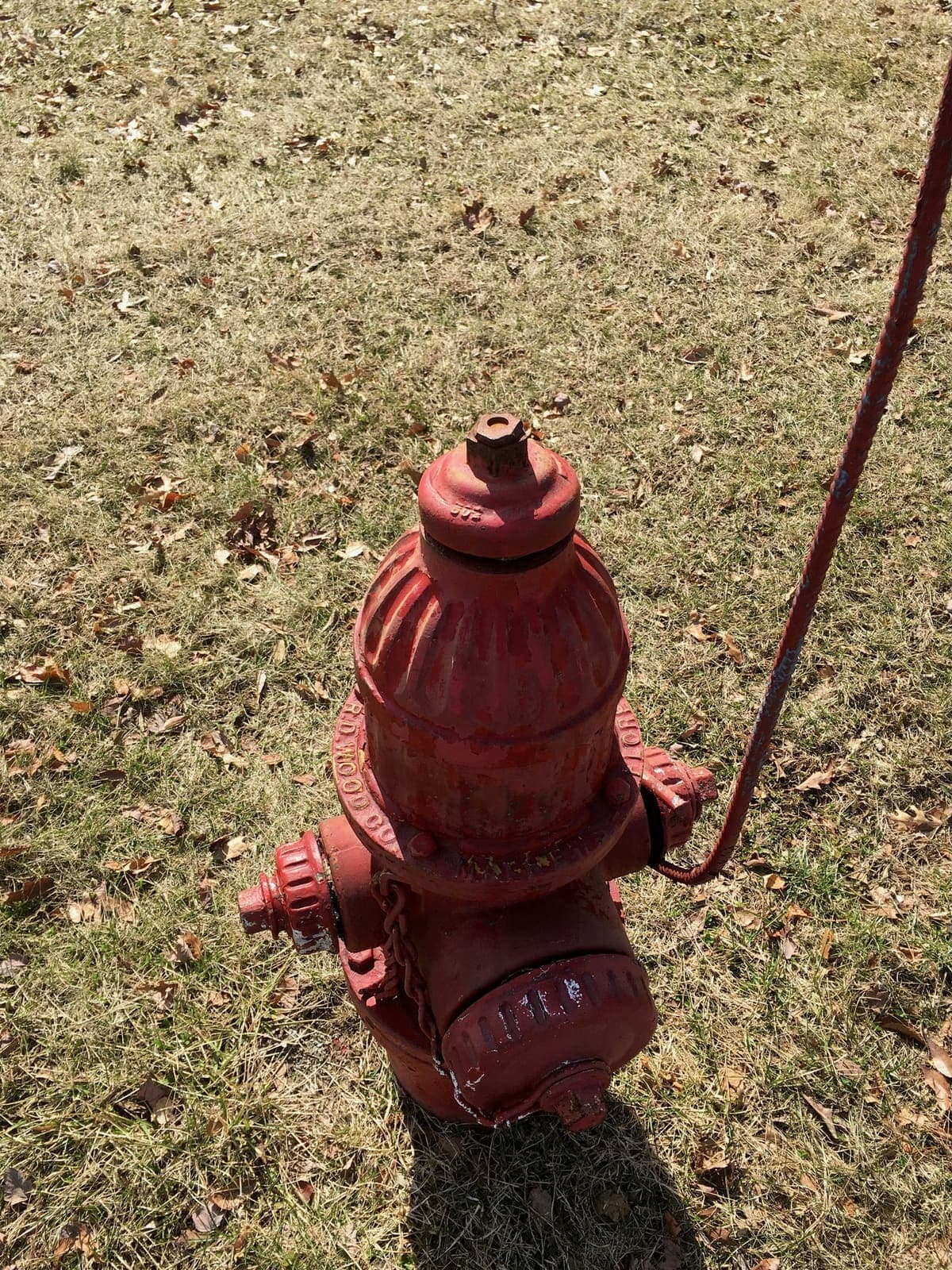 Private fire hydrant on a commercial property, with its marker post